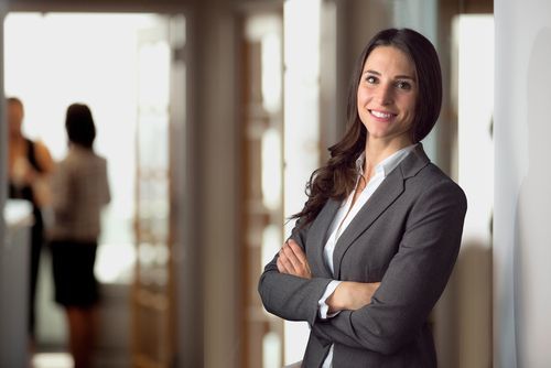 Attorney in hallway with arms crossed