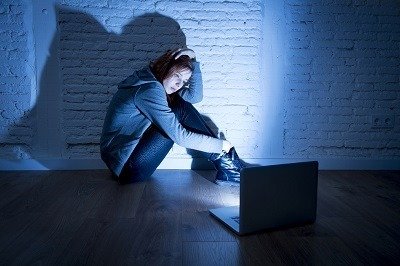 girl behind computer screen
