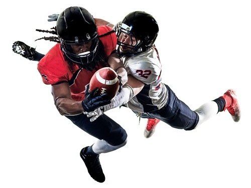 one football player tackling another