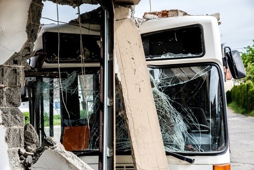 Aftermath of a bus accident showing the bus with a cracked windshield