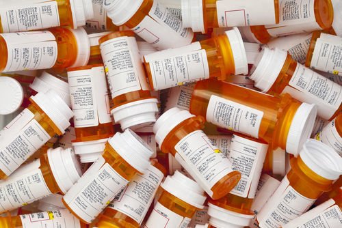 pile of prescription drug bottles
