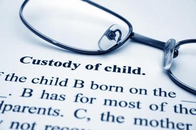 pair of glasses on top of paper that reads "custody of child"