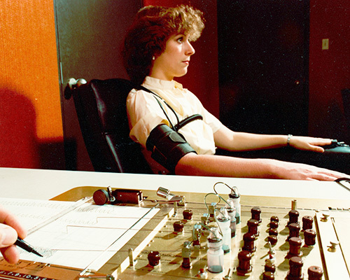 Woman submitting to a polygraph test