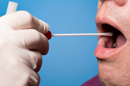 mouth swab test being administered