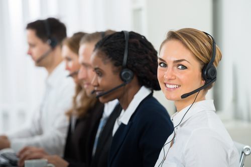 Team of five receptionists with headsets