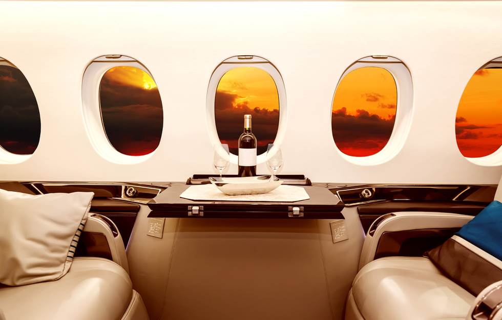 bottle of wine on table in private airplane