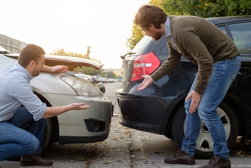 Aftermath of a rear-end collision to illustrate the low impact defense