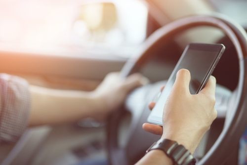 person driving while using smartphone california legal defense