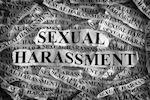 Sexual harassment written on newspaper print