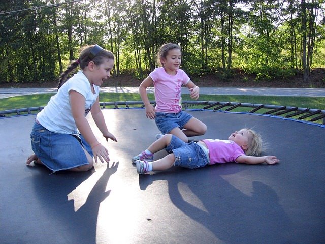 Three children on a trampoline