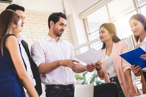 staff and manager meeting in office - the executive exemption in California applies to certain managerial employees
