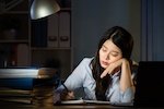 woman sleeping at desk