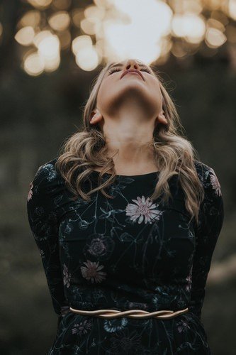 girl with her head tilted back