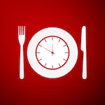 reloj de plato con un cuchillo y un tenedor a cada lado