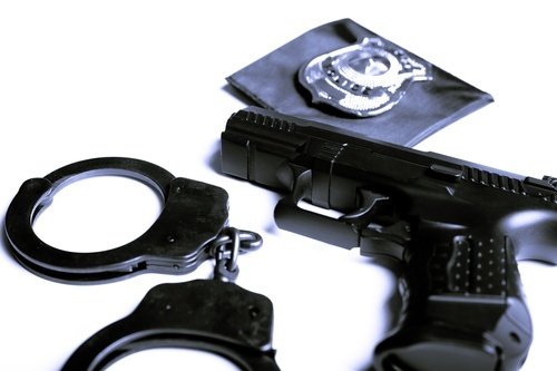 gun, handcuffs, police badge