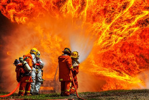 firefighters fighting a large blaze - firefighters have enhanced workers' compensation benefits in Nevada