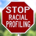 Stop sign that says "Stop Racial Profiling"