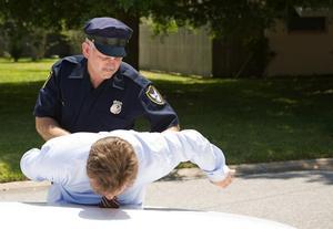 Police officer handcuffing a civilian