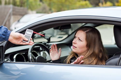 motorist being asked to submit to a handheld breath test - California's implied consent law requires people arrested for DUI to submit to a chemical test