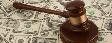 judge's gavel on a pile of money (alimony)