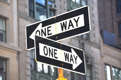 one way signs pointing in different directions
