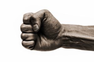 Close-up of fist against a white background