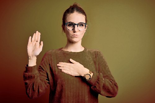 girl raising her right hand to take an oath