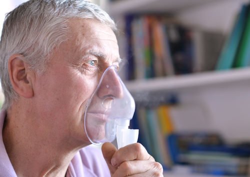 man with a face mask to help breathing