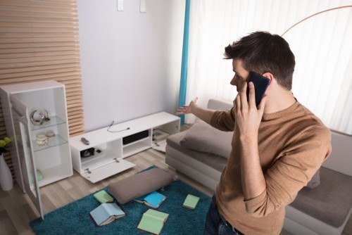 burglary victim is on the phone, shocked