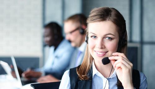 female receptionist smiling with headset on