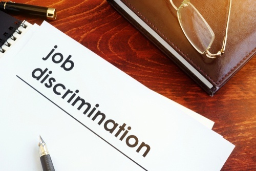 binder with front page titled "job discrimination"
