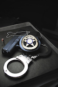 handcuffs, badge, gun