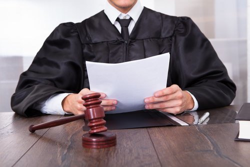 judge reading settlement