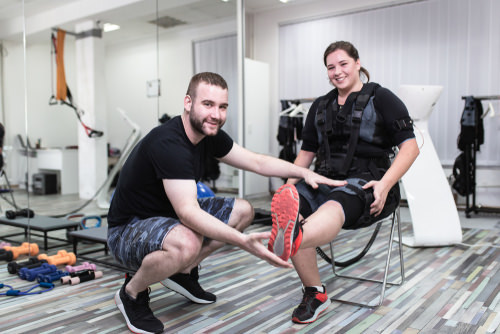 physical therapist extending a patient's injured leg