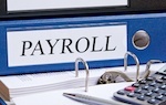 binder that says "payroll" on spine