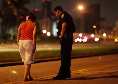 DUI suspect performing walk-and-turn test at night
