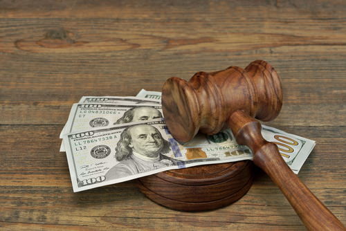 money under a judge's gavel