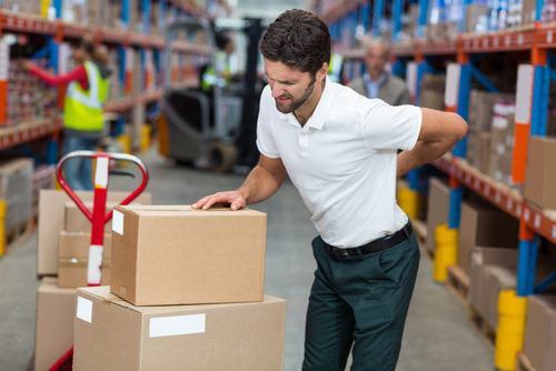 wholesale store stocker clutching his lower back in apparent pain