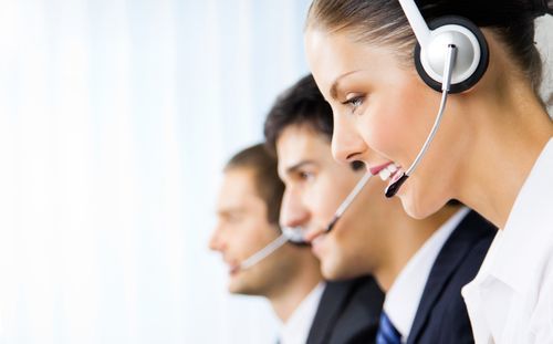 Three receptionists with headsets