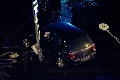 car after crashing into pole at night