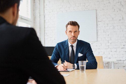 Attorney depositing a witness in a board room