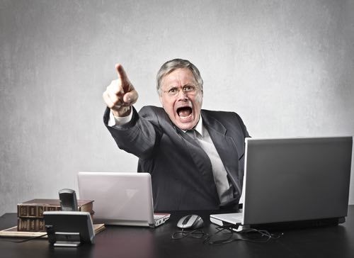 angry boss pointing finger and yelling - the post termination defense relates to collecting workers' compensation benefits after leaving the job