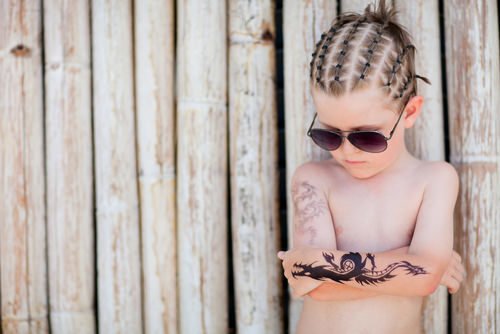 tattooed young child
