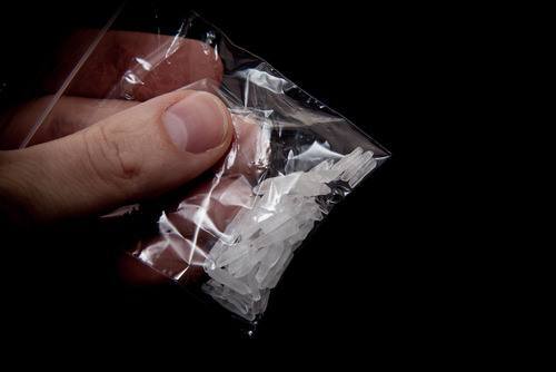 small baggie containing methamphetamine crystals - sale, possession or consumption of meth is illegal in California