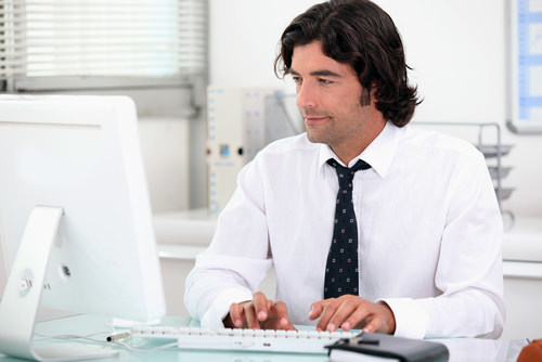 man typing away free from sexual harassment