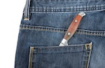 knife in jeans back pocket
