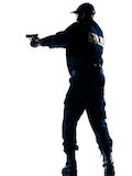silhouette of police wielding gun