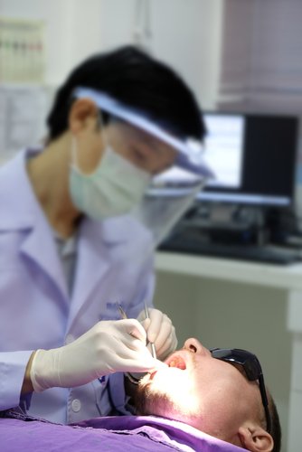 dental professional working on patient