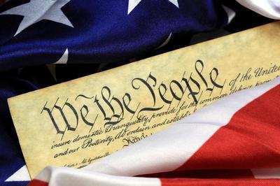 U.S. Constitution elegantly draped in the American flag