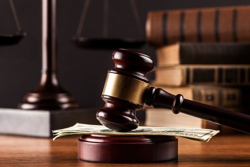 zostavax litigation compensation gavel and money